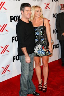 Simon Cowell and Britney Spears at Mixology101 & Planet Dailies on December 6, 2012 in Los Angeles, California.