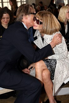 Anna Wintour is kissed by actor Bill Nighy as they sit front row for the Nicole Farhi show during London Fashion Week in 2013.