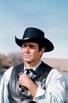 US actor Stuart Whitman wearing a black Western hat and black leather waistcoat with a sheriff's badge in a scene from the American western television series 'Cimarron Strip', USA, circa 1967. (Photo by Silver Screen Collection/Getty Images)
