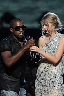 Kanye West jumps onstage as Taylor Swift accepts her award for the "Best Female Video" award during the 2009 MTV Video Music Awards at Radio City Music Hall on September 13, 2009 in New York City. 