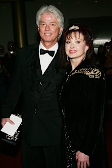 Singer Naomi Judd and husband Larry Strickland arrive at the 27th Annual Kennedy Center Honors Gala at The Kennedy Center for the Performing Arts December 5, 2004 in Washington, DC. 