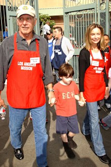 Actor Harrison Ford and actress Calista Flockhart with son Liam participate in serving Thanksgiving dinner to the Skid Row homeless at the Los Angeles Mission hosted by Kirk Douglas and Anne Douglas on November 21, 2007 in Downtown Los Angeles, California. 