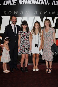 Catherine Fitzgerald and Dominic West attend the Johnny English Reborn UK premiere with their children in 2011