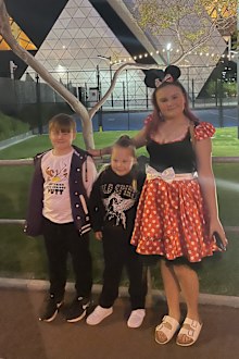 Emilia with her elder sibling, Corben (left) and Myra (right).