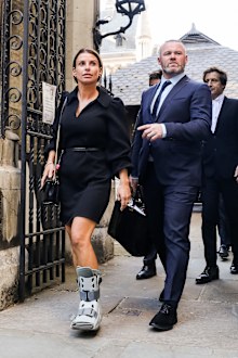Coleen Rooney and Wayne Rooney leave the Royal Courts of Justice, Strand on May 17, 2022 in London, England. 