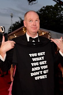 Tom Gleeson is seen posing for a photograph on the red carpet at the 2019 TV Week Logie Awards