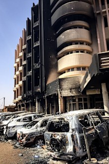 Bombed car wrecks and damage outside the Cappuccino cafe in Ouagadougou, following a terror attack in Burkina Faso