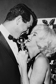 Marilyn Monroe receives her Golden Globe award from Rock Hudson at the Hollywood Foreign Press Association's 19th Annual Dinner, Beverly Hilton