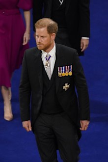Britain's Prince Harry arrives at Westminster Abbey in a morning suit, with his medals.