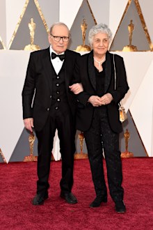 talian composer Ennio Morricone and his wife Maria Travia attend the 88th Annual Academy Awards at Hollywood & Highland Center on February 28, 2016 in Hollywood, California.