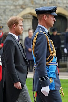 WINDSOR, ENGLAND - SEPTEMBER 19 Prine Harry, The Duke of Sussex and Prince William, Prince of Wales follow the State Hearse carrying the coffin of Queen Elizabeth II, draped in the Royal Standard with the Imperial State Crown and the Sovereign's Orb and Sceptre, as it arrives at the Committal Service held at St George's Chapel in Windsor Castle on September 19, 2022 in Windsor, England. The committal service at St George's Chapel, Windsor Castle, took place following the state funeral at Westmin