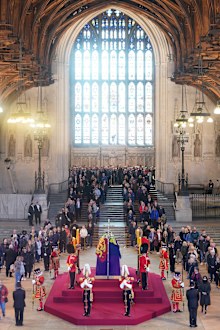 Members of the public file past the coffin of Queen Elizabeth II, draped in the Royal Standard with the Imperial State Crown and the Sovereign's orb and sceptre, lying in state on the catafalque in Westminster Hall, at the Palace of Westminster, ahead of her funeral on Monday, on September 16, 2022 in London, England.  