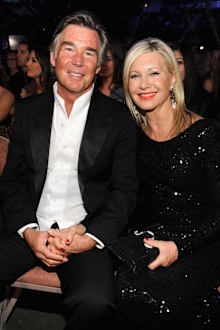 Singer Olivia Newton-John and husband John Easterling attend the 2013 American Country Awards at the Mandalay Bay Events Center on December 10, 2013 in Las Vegas, Nevada.