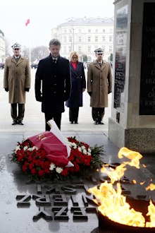 King Frederik X pays his respects to Polish war dead at the Tomb of the Unknown Soldier in Warsaw, Poland, on Wednesday, Jan. 31, 2024. 