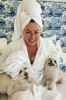 Shelly Horton in bed with her dogs