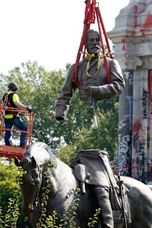 The top part of the General Robert E. Lee statue was lifted during its removal on Monument Avenue in Richmond, Virginia. 