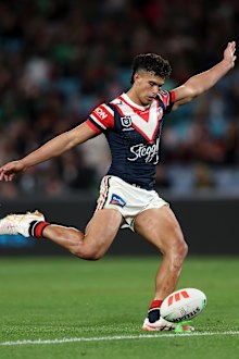 Joseph-Aukuso Suaalii of the Roosters kicks a conversion.
