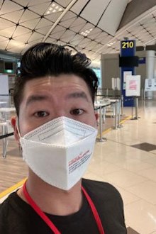 Traveller Darryl Chan waits for his coronavirus test results at Hong Kong airport on December 19, 2021.