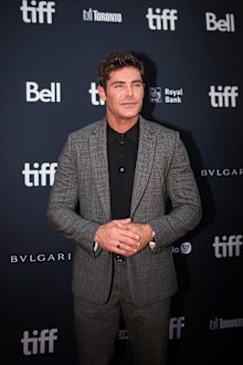 Zac Efron poses for a photograph on the red carpet for the film, "Greatest Beer Run Ever," at Roy Thomson Hall during the Toronto International Film Festival, 2022.