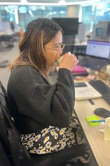 Sindy taste testing a coffee