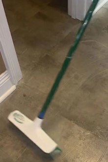 Cleaner transforms filthy floor using a broom hack before mopping.