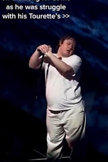 Lewis Capaldi fans finish song while he experiences tics during concert.