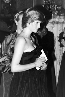 princess diana black taffeta dress March 9, 1981: Diana wears a strapless black taffeta dress designed by  David and Elizabeth Emanuel to her first Royal Engagement as the future  Princess of Wales.  The gown immediately captured
