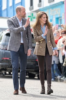TOBERMORY, SCOTLAND - APRIL 29: Prince William, Prince of Wales, known as the Duke of Rothesay and Catherine, Princess of Wales, known as the Duchess of Rothesay when in Scotland, smile and wave to well-wishers as they arrive for a visit to Aros Hall, a local community hub on April 29, 2025 in Tobermory, Scotland. The Prince and Princess of Wales are on a two-day visit to the Isles of Mull and Iona on the 29th and 30th of April to engage with rural island communities. During their time on the is