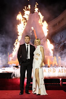Sam Worthington and Lara Worthington attend the world premiere of 20th Century Studios "Avatar: Fire and Ash"