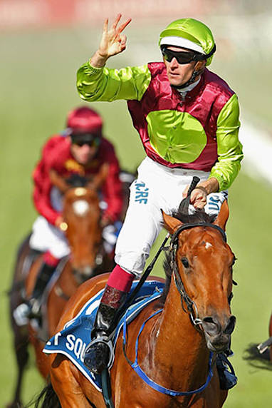Hugh Bowman celebrates the win in the VRC Oaks.