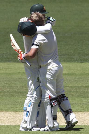 The captain embraced David Warner as the opener scored his century. (AAP)