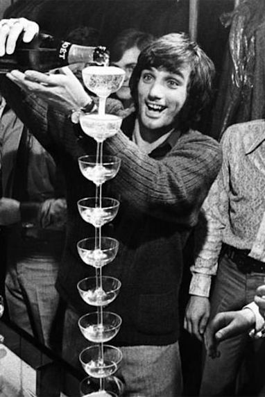 Football legend George Best was known for his champagne lifestyle. (Supplied)