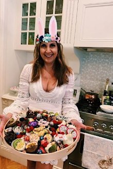 Greek woman holds desserts usually consumed on Greek Easter.