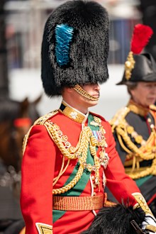 LONDON, ENGLAND - JUNE 02: Prince William, Duke of Cambridge, in his role as Colonel of the Irish Guards, rides his horse along the Mall during the Royal Procession ahead of the Trooping the Colour parade on June 2, 2022 in London, England. Trooping The Colour, also known as The Queen's Birthday Parade, is a military ceremony performed by regiments of the British Army that has taken place since the mid-17th century. It marks the official birthday of the British Sovereign. This year, from June 2 