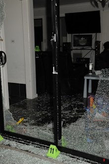Photographs tendered by the prosecution show extensive damage to the inside of the home.