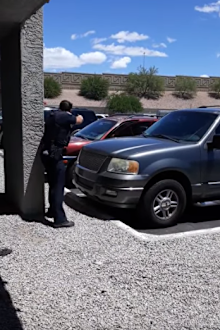 Parents say police pulled guns on them after 4-year-old daughter took a doll from a store in Phoenix