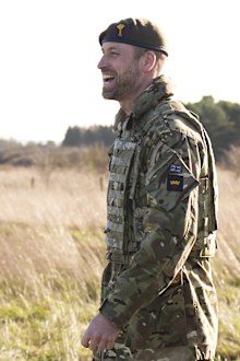 Britain's Prince William, the Prince of Wales and Colonel of the Welsh Guards, laughs, during a visit to the 1st Battalion Welsh Guards to hear how they have been transitioning from ceremonial duty back to the Field Army, at Salisbury Plain, in Wiltshire, England, Tuesday, Nov.  26, 2024. (Aaron Chown/Pool Photo via AP)