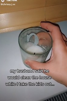 Woman cleaning trap