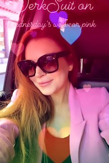 Lindsay Lohan, dancing, outside gas station, pink suit