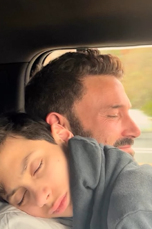 Ben Affleck cuddles Jennifer Lopez's son Max during Thanksgiving celebrations.