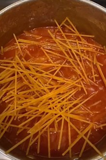 Woman cooking pasta