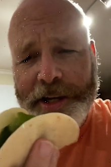 Man eating hotdog