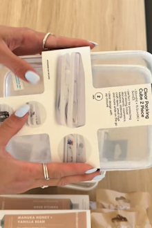 TikTok creator Lauren (@Bylaurennicole) first showed how you could use the two-pack clear packing cubes from Kmart to make a gift basket.