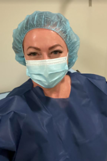 Shelly Horton wearing scrubs for her colonoscopy.