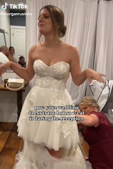 bride cuts wedding dress due to heat