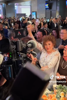 Michelle Yeoh's mum, Janet Yeoh, celebrates her daughter's Oscar win from a telecast in Malaysia.