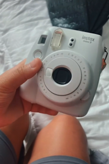 Mum packed polaroid camera in maternity hospital bag.