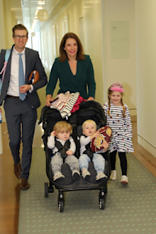 Queensland MP Anika Wells, the new Minister for Aged Care and Sport walking with her family.