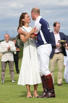 Prince William, Duke of Cambridge and Catherine, Duchess of Cambridge embrace after the Royal Charity Polo Cup 2022 at Guards Polo Club  during the Outsourcing Inc. Royal Polo Cup at Guards Polo Club, Flemish Farm on July 06, 2022 in Windsor, England. 