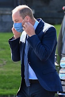 Prince William, Duke of Cambridge puts on a face mask as he meets attendees of a PSNI Wellbeing Volunteer Training course, including representatives from the Ambulance and Fire and Rescue services, to talk about mental health support within the emergency services at PSNI Garnerville on September 09, 2020 in Belfast, Northern Ireland